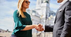 Two persons shaking hands